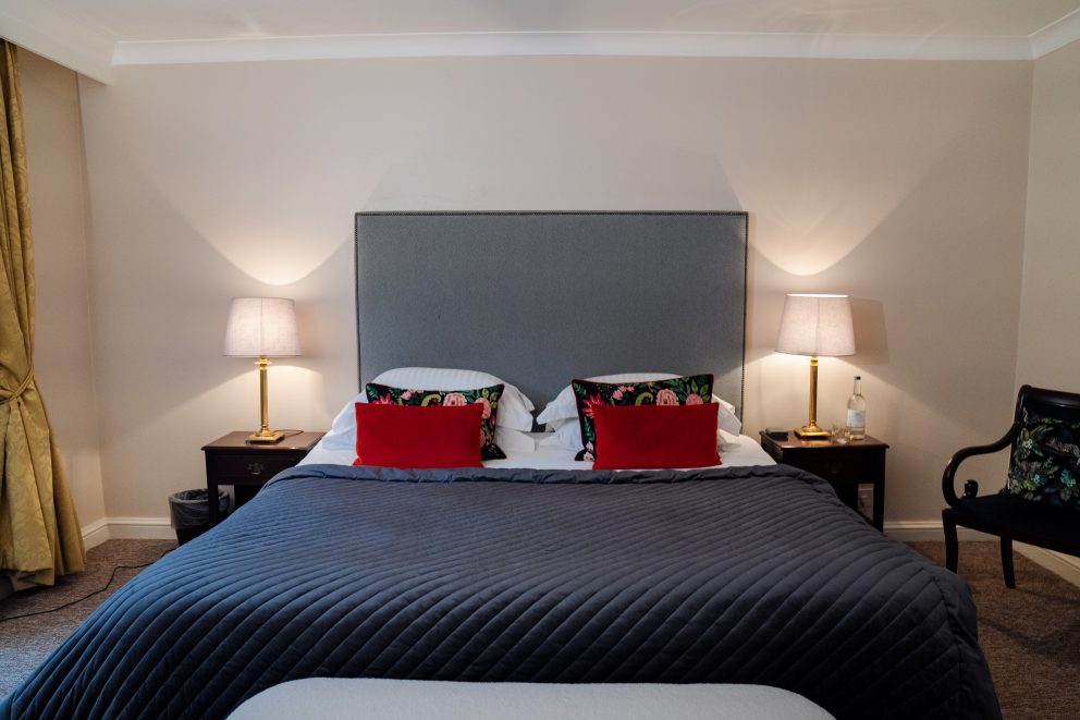One of our apartment bedrooms, showing the bed and bedside tables.